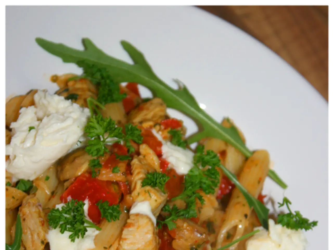 There is a food item is kept in a white color plate as we can see in the middle of this image....