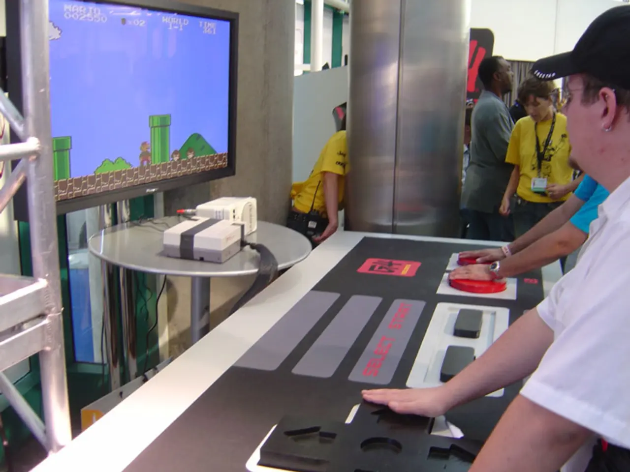 In this picture there is a man and television screen over here