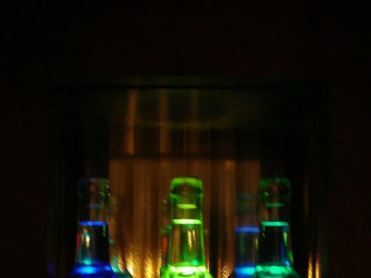 In this image I see few bottles, which are of different in colors.