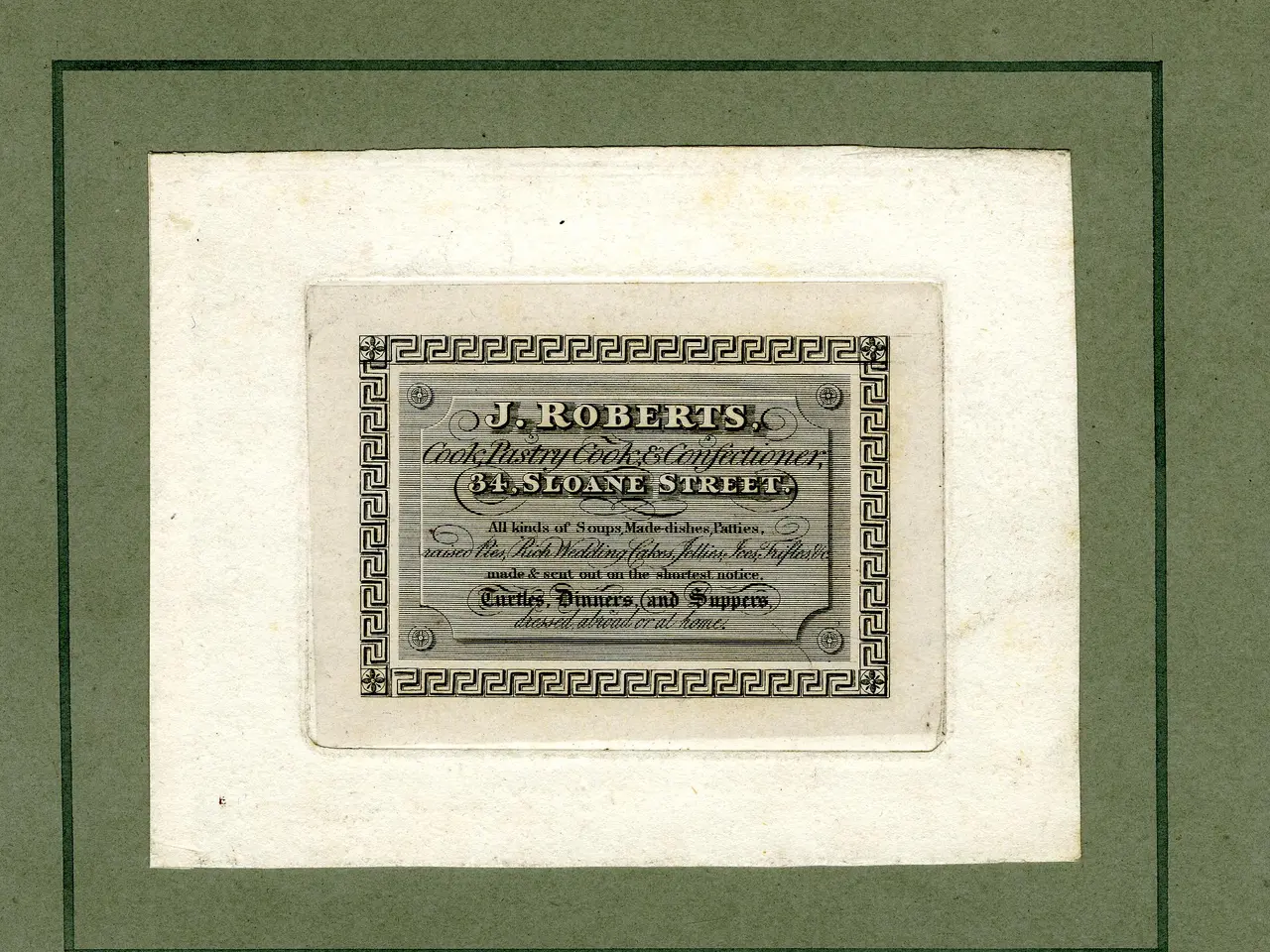 The image shows a photo frame with a paper inside featuring text and numbers. The text reads "J.R....