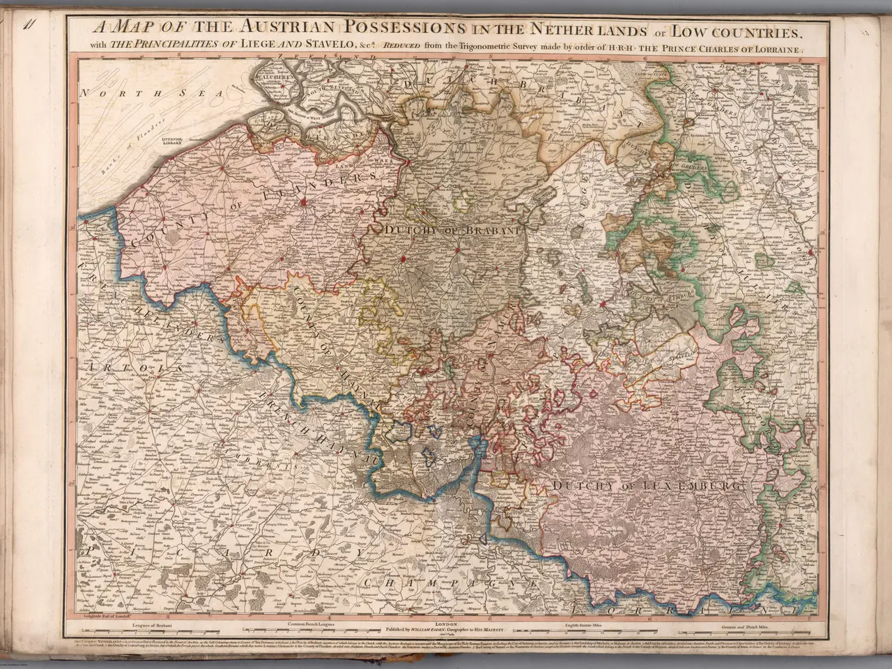 The image shows an open book with a map of the Austrian possessions in the Netherlands and Low...