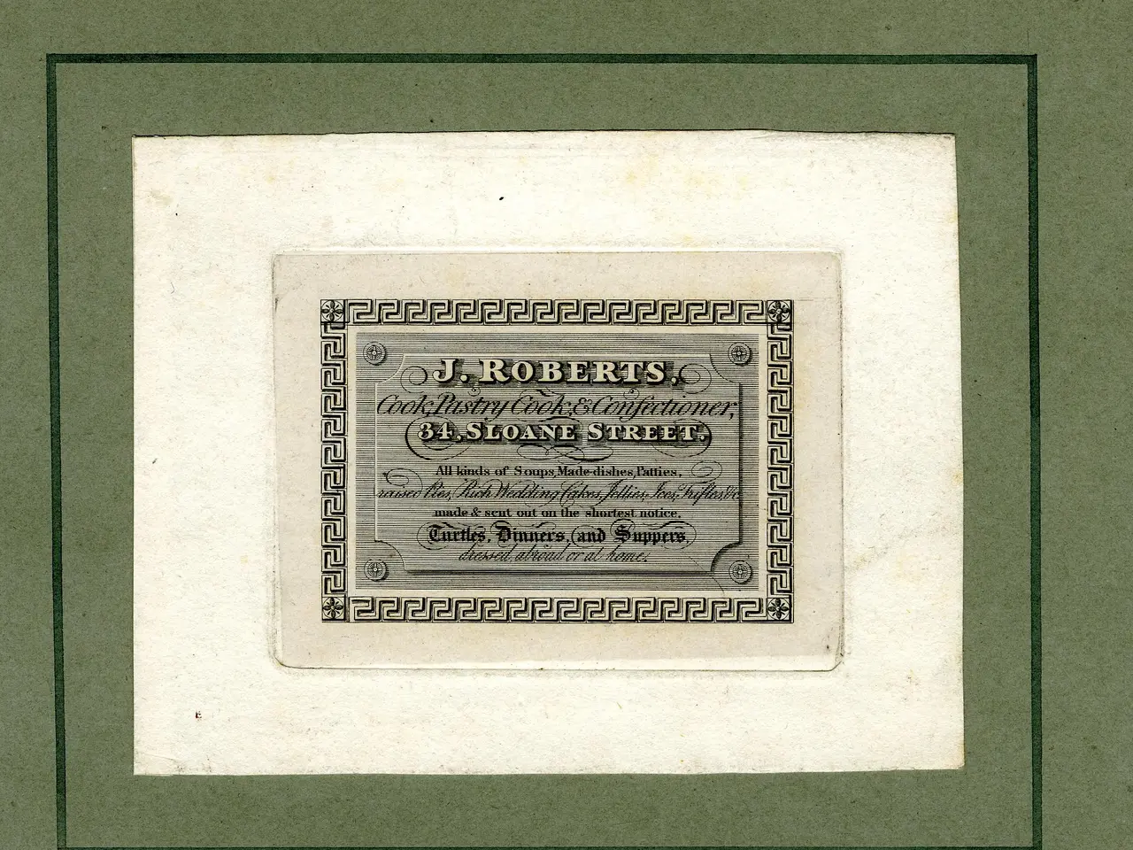 The image shows a photo frame with a paper inside featuring text and numbers. The text reads "J.R....