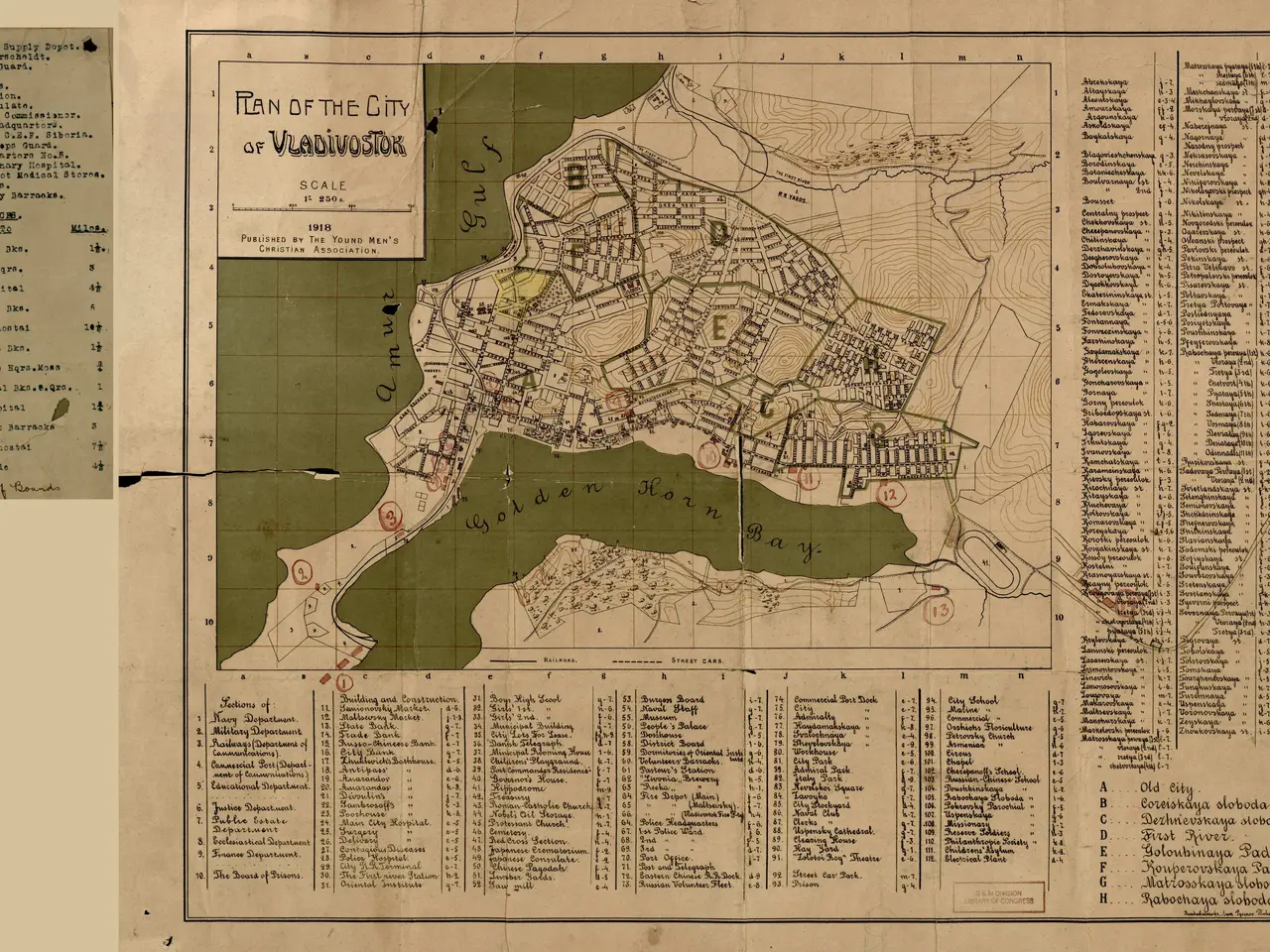 The image shows an old map of the city of Vladivostok, with text written on it. The map is...