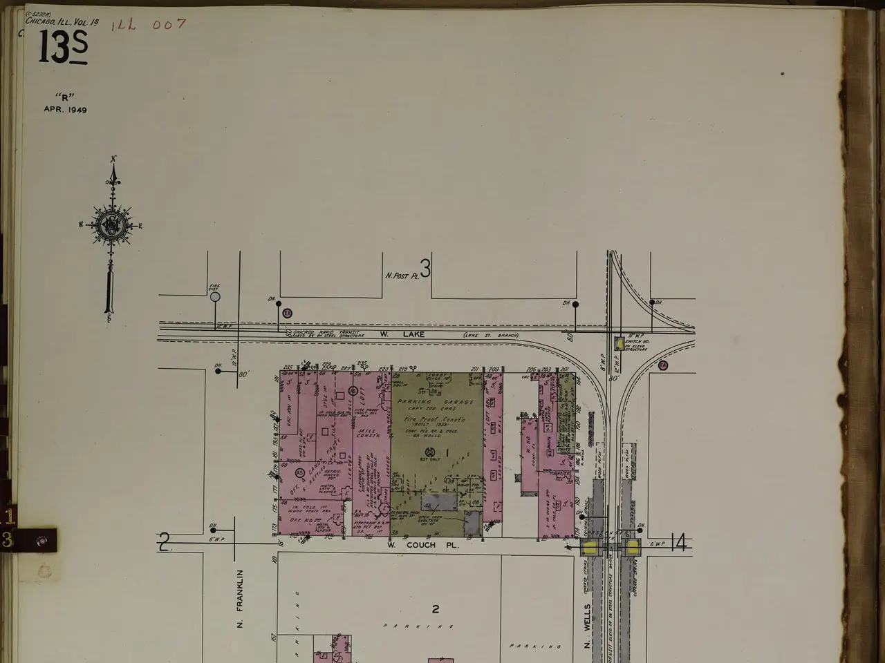 The image shows an open book with a drawing of a city on it. The book is filled with detailed plans...