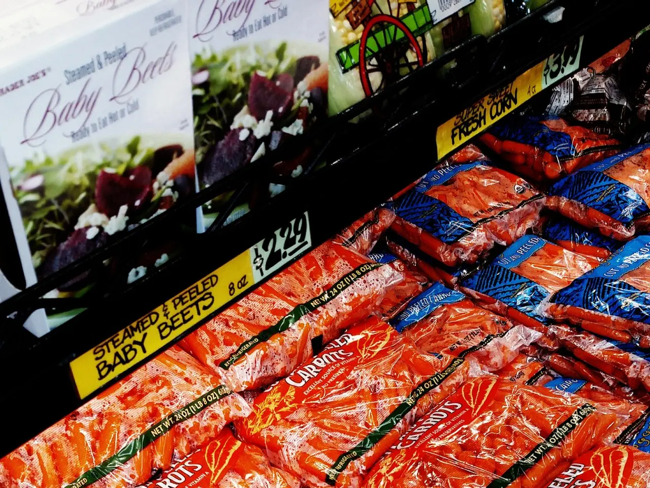 The image shows a grocery store with a display case filled with lots of different types of food,...