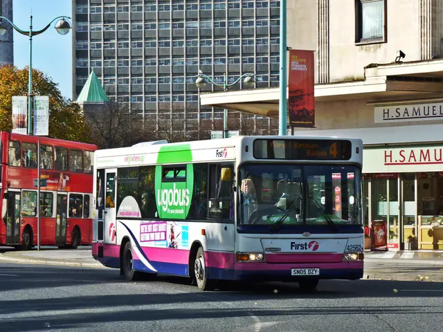 Westbound Buses F and FM momentarily halt operations on the western side of the central station