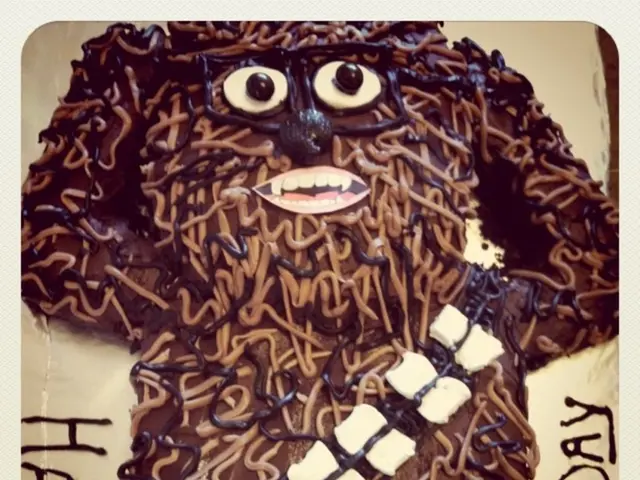 Here in this picture we can see a cake designed as a person body present on the table and in the...