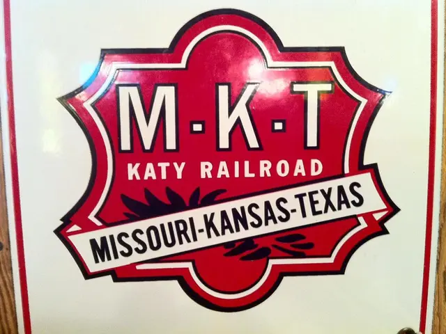 In this image in the foreground there is a board, on the board there is text.