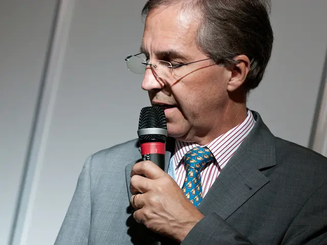 As we can see in the image there is a man holding mic.