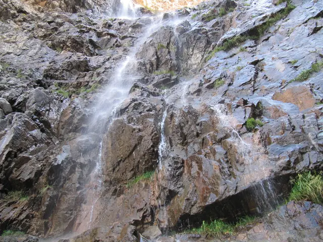 In this picture we can see the close view of the mountain rock with waterfall.