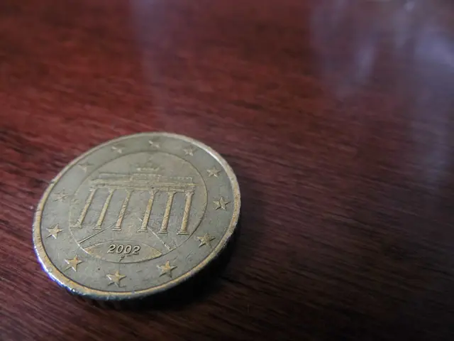 In this image we can see a coin placed on the table.