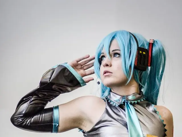 In this image there is a picture of a girl who is wearing the silver color costume and she is also...