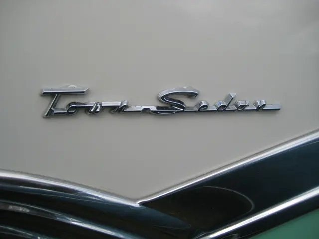 In this image we can see a label name of a car.