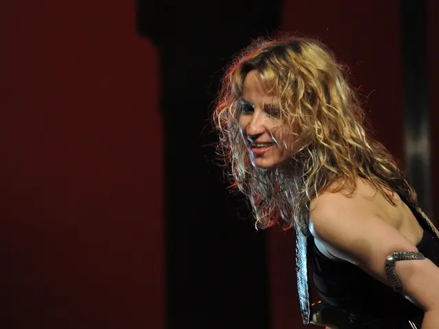 In this image we can see a woman smiling.