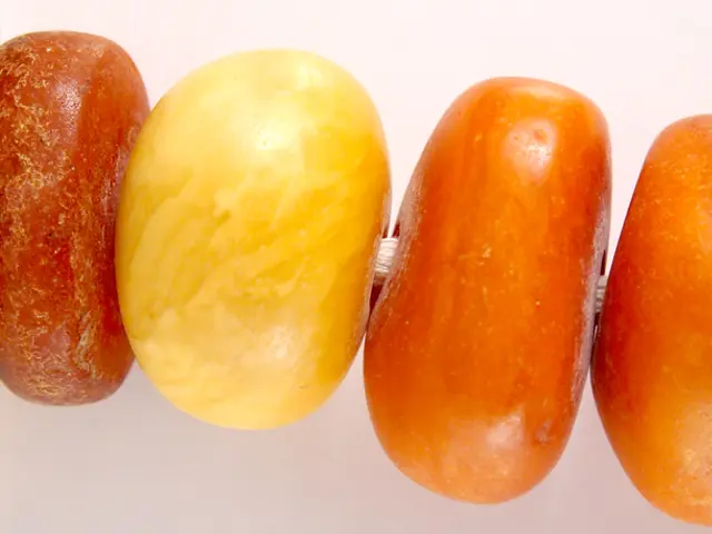 In this image there are different kind of vegetables placed one after the other on the stick. On...