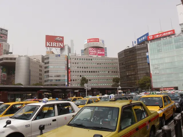 This is the picture of a city. In this image there are vehicles on the road. At the back there are...