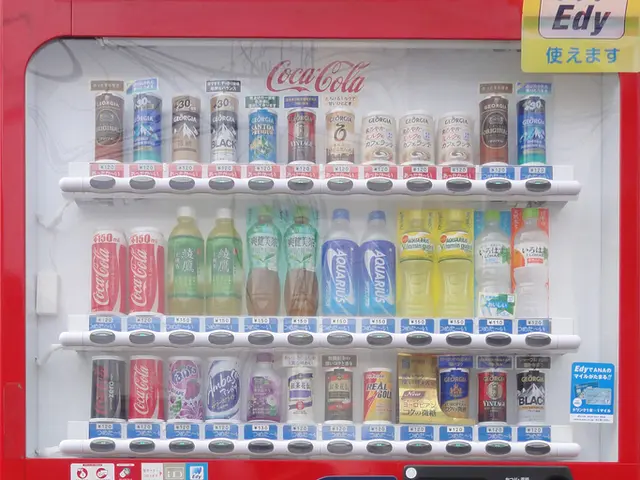 In this image I can see a Coca-Cola vending machine. At the top there are few bottles arranged...