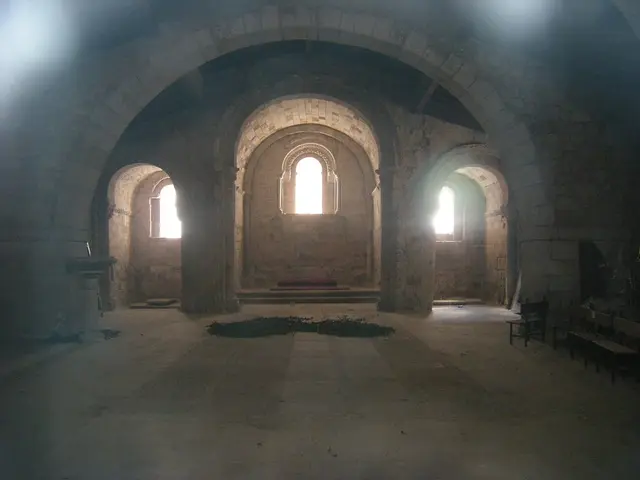 In this picture there is a inside view fort. In the front there are three arches and small windows...