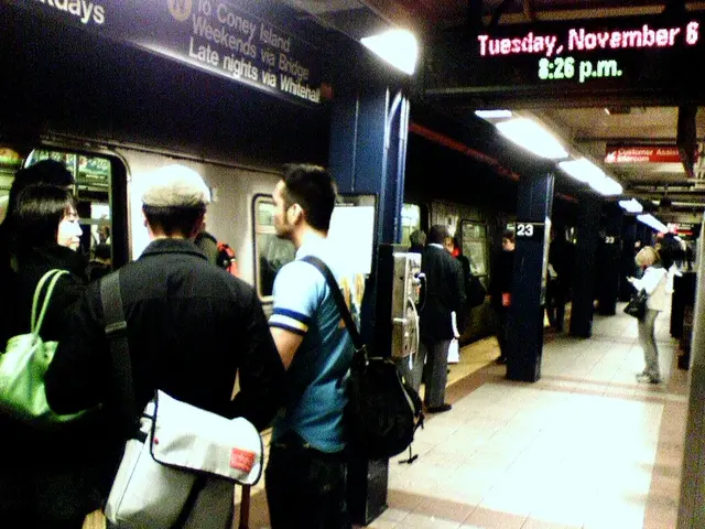 Here I can see many people are wearing bags and standing on the platform. On the left side there is...