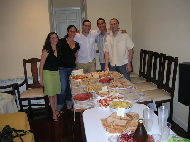 There are five member standing here posing for a picture. Two of the were women and the remaining...