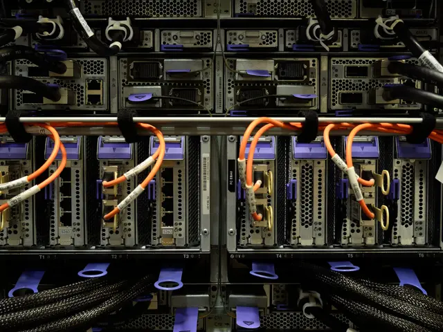 The image shows a rack of servers in a data center, with a variety of cables and electronic devices...