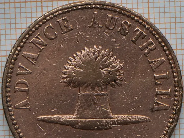 The image shows a copper coin with the words "Advance Australia" on it, resting on a surface.