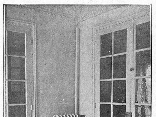 The image shows a black and white photo of a room with a radiator in the center, two doors on...