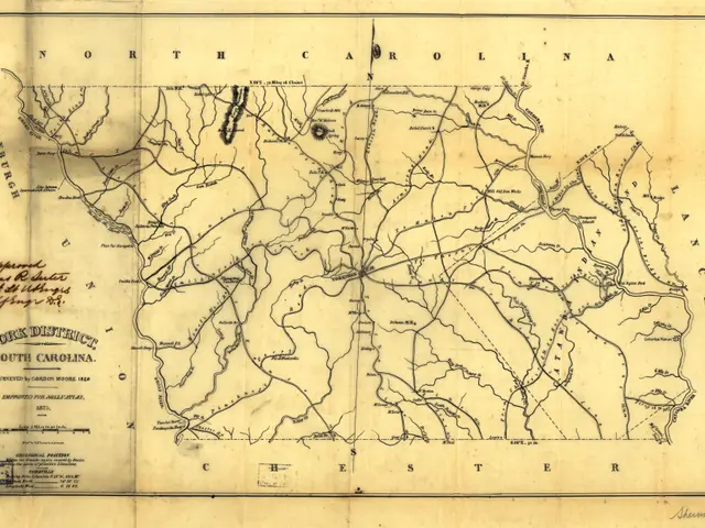 The image shows an old map of the state of North Carolina on a piece of paper. The map is detailed...