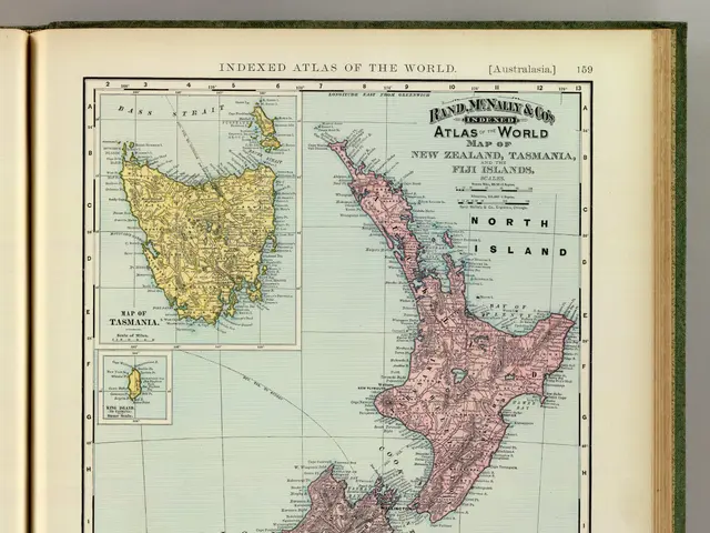The image shows an open book with a map of New Zealand on it. The map is detailed and shows the...