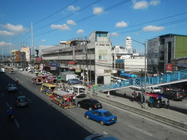 The image shows a bustling city street filled with lots of traffic, including cars, buses, and...