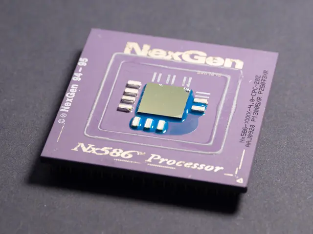 The image shows a close up of a purple nexgen nx586 processor on a black surface. The chip is...