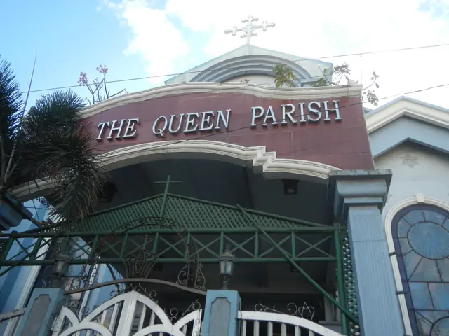 The image shows the Queen Parish Church in Manila, Philippines. It is a building with a name board...