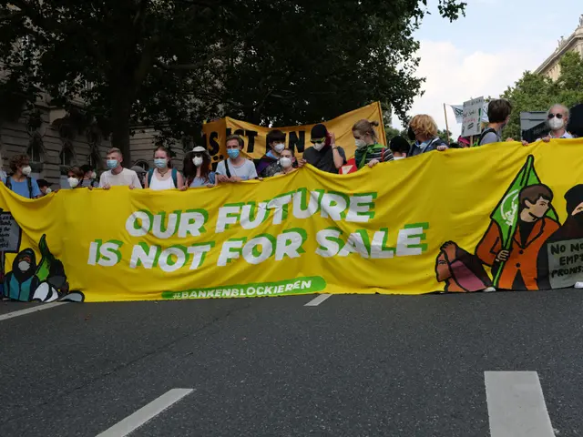 The image shows a group of people wearing masks and holding a banner that reads "Our Future is Not...