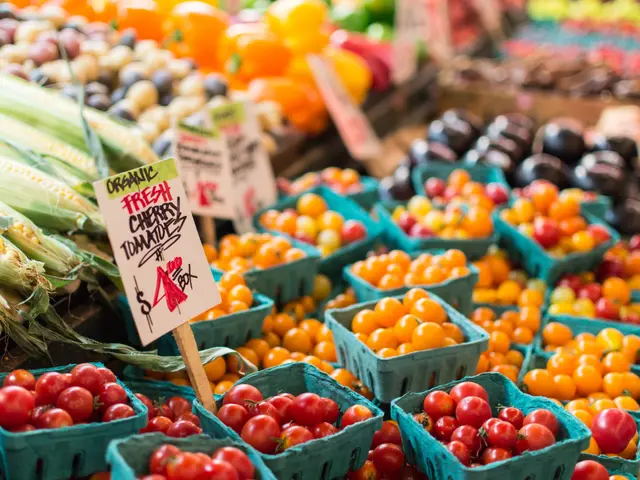 The image shows a farmers market with a variety of fresh produce, including tomatoes, corn, and...