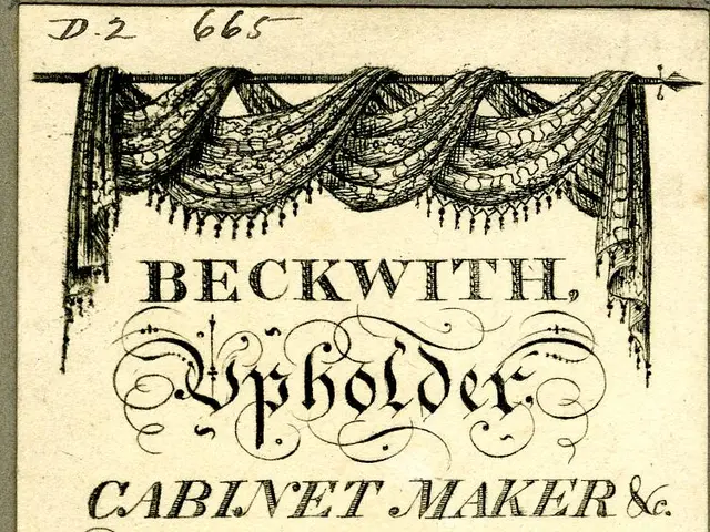 The image shows an old business card with a picture of a couch on it, along with text and a stamp....