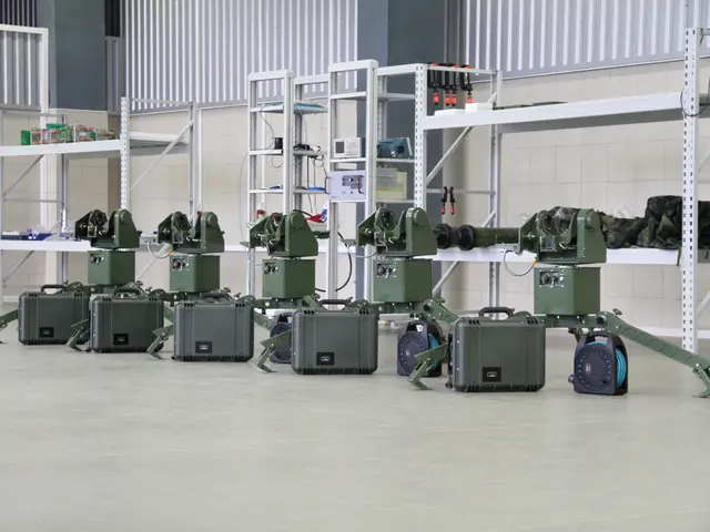 The image shows a group of military robots sitting on top of a floor, surrounded by suitcases and...