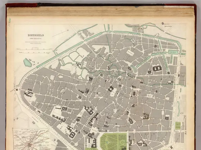 The image shows an old book with a map of the city of Brussels on it. The map is detailed and shows...
