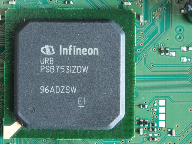 The image shows a close up of a circuit board with a chip on it. The chip is labeled with text,...