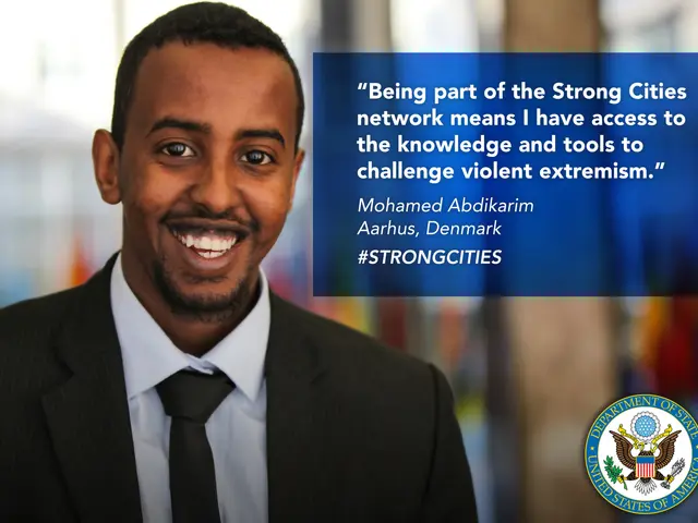 The image shows a man in a suit and tie smiling at the camera, with a logo and text on the right...