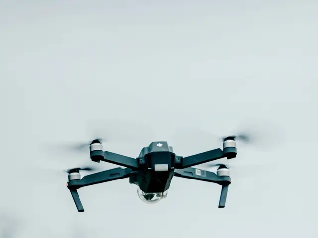 The image shows a DJI Mavic Air Fly More Combo drone flying in the air with a blurred background of...