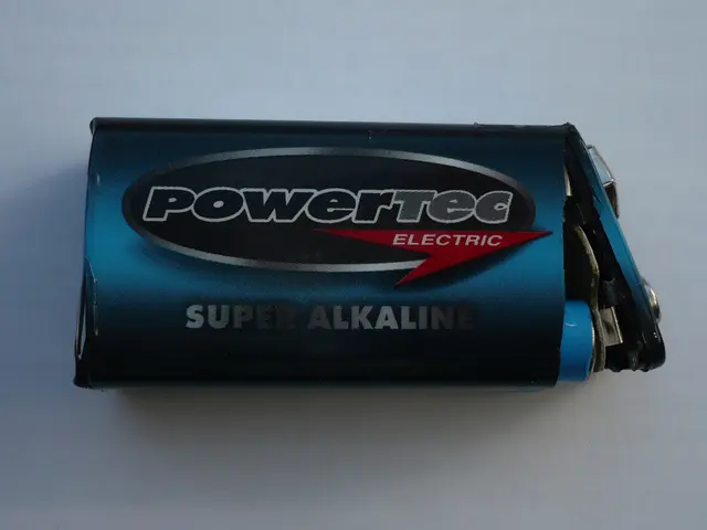 The image shows a blue Powertec Super Alkaline battery on a white surface. The battery is labeled...