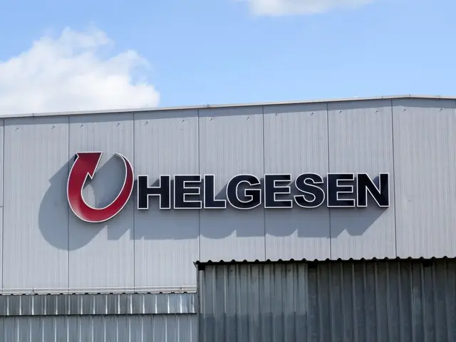 The image shows a helgesen sign on the side of a building, with a cloudy sky in the background. The...