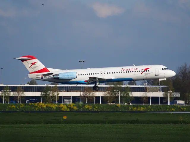 The image shows an Austrian Airlines Airbus A320-200 taking off from Frankfurt Airport, surrounded...