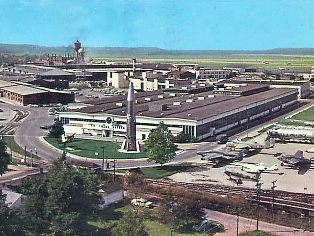 The image shows an old photo of an airport with airplanes parked on the ground, surrounded by...