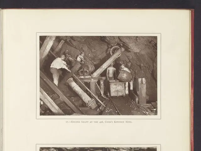 The image shows an open book with two pictures of men working in a coal mine. The book is titled...