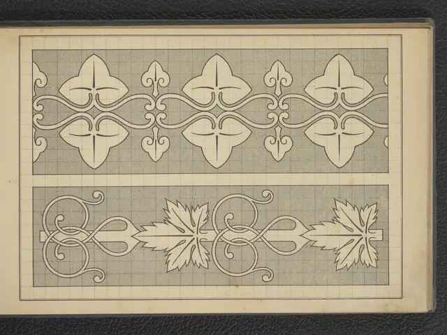 The image shows a book with a drawing of a design on it placed on a surface. The design is...