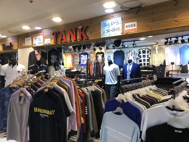 The image shows a clothing store filled with lots of shirts on display, with mannequins wearing the...