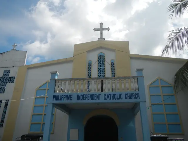The image shows the Philippine Independent Catholic Church in Cebu City, Philippines. It is a white...