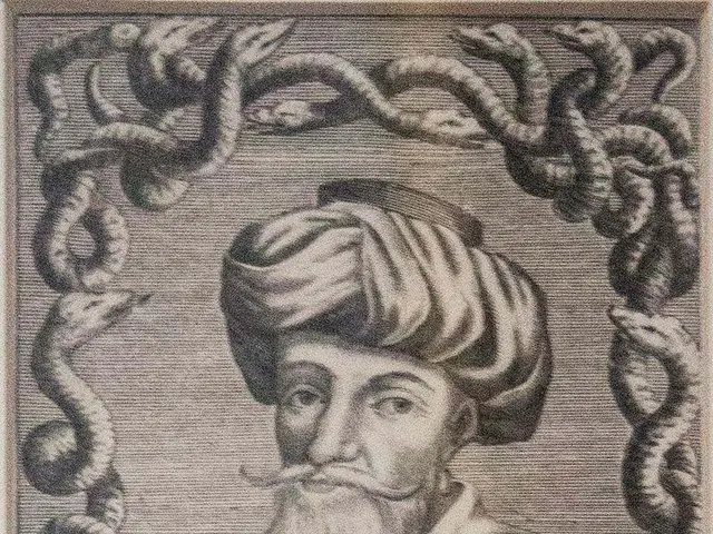 The image shows an engraving of a man with a long beard and a turban, surrounded by a frame of...