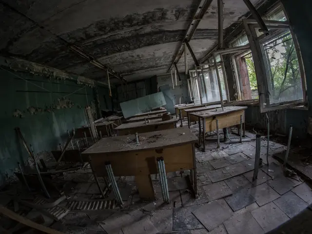 The image shows an abandoned classroom in Pripyat, Chernobyl, Ukraine. The room is filled with...